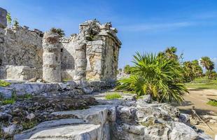 Ancient Tulum ruins Mayan site temple pyramids artifacts seascape Mexico. photo