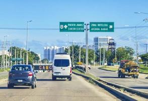 Cancun Quintana Roo Mexico 2022 Typical street road cars buildings and cityscape of Cancun Mexico. photo