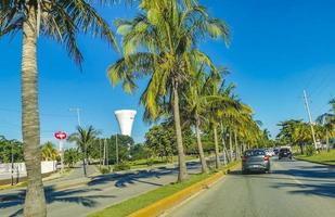 Cancun Quintana Roo Mexico 2022 Typical street road cars buildings and cityscape of Cancun Mexico. photo