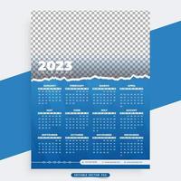 diseño moderno de calendario de año nuevo 2023 con color azul y efecto de pincel. calendario de negocios y plantilla de organizador de escritorio con formas abstractas. plantilla de diseño de calendario de año nuevo. la semana comienza el domingo. vector