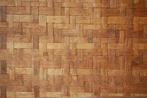 The background wall of the house is made of woven bamboo. photo