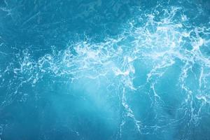 Sea  Waves in ocean wave Splashing Ripple Water. Blue water background. photo