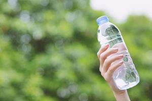 Sport man drinking water bottle. photo