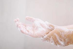 Washing hands rubbing with soap man for corona virus prevention, hygiene to stop spreading coronavirus. photo