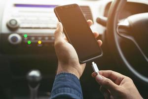 Power plug charging phone in car. photo