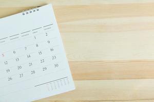 calendar on the table wooden. empty copy space for text. concept for busy timeline organize schedule,appointment and meeting reminder. planning for business meeting or travel holiday planning concept. photo