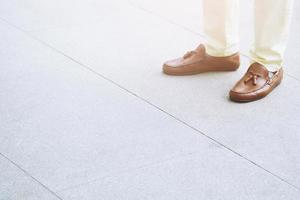 Young man walking crosswalk on the road for safety when people at the junction street of city, Pedestrian safety, Aerial top view. Leave empty space blank to Write a message on road floor. photo