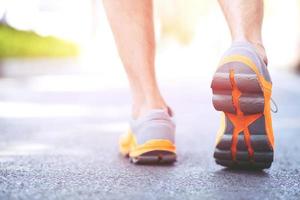 young fitness woman hiker legs at forest trail photo