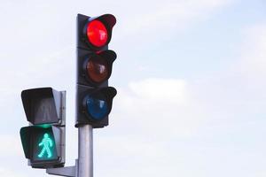 Red traffic lights in the middle of the intersection photo