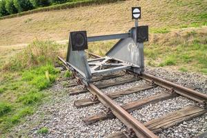 buffer stop on a railroad line photo