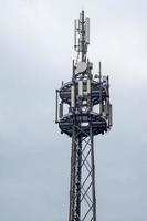 cell phone tower with grey background photo