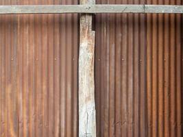 Old zinc wall texture background, rusty on galvanized metal panel sheeting. photo