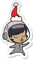sticker cartoon of a pretty astronaut girl wearing santa hat vector