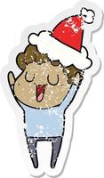 laughing distressed sticker cartoon of a man wearing santa hat vector