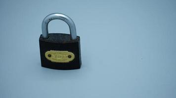 Locked Golden Padlock on the white background. photo