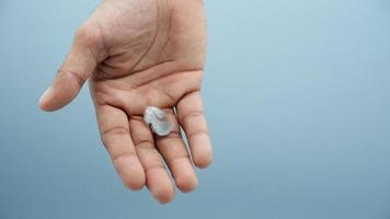 pigeon wing in hand on white background photo