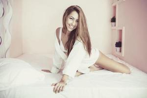 Beautiful  Woman at bed photo