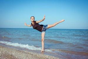 Young cheerful girl on the sea photo