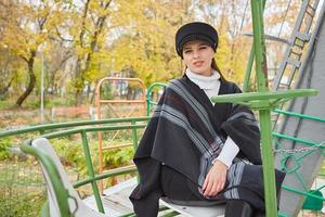 Beautiful gentle woman in the autumn park photo