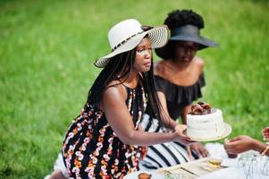 Group of african american girls celebrating birthday party outdoor with decor. photo