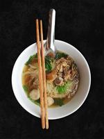 thai noodle with beef, soup braised meat style, asian food appetizing on black background photo