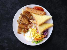 Steak fish with salad and toasted bread on plate, Top view food  sausage and vegetable on background photo