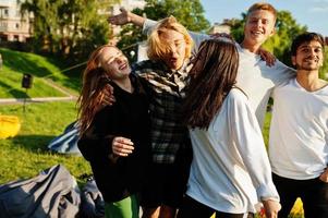 Young multi ethnic group of people in open air cinema. photo