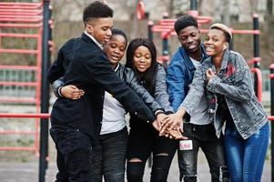 Young millennials african friends on outdoor gym. Happy black people having fun together. Generation Z friendship concept. photo