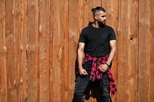 Arab hipster beard man lumberjack against wooden background. photo