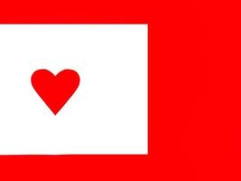 White paper perforated into a heart shape. Placed on a red background photo