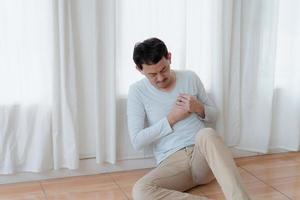 a man touching his heart, with red highlight of heart attack, and others heart disease concept, Heart attack symptom photo