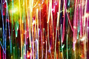 Abstract burred texture background of colorful bokeh motion. Long exposure of small neon lights photo