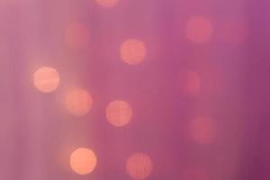 abstract blurred lights on background in pink colors - christmas celebration concept photo