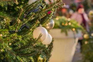 Christmas and New Year holidays background.  Christmas tree decorated with gold and white balls. Celebration concept photo