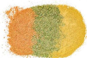 Texture of colorful spices of orange, yellow and green colors. photo