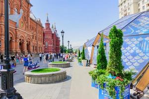 MOSCOW, RUSSIA, 2019 - Tourists walking on Revolution Square durin fish week festival pavillions. photo