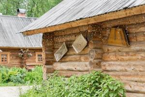 corner of log house with decoration on the wall photo