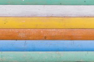 Multicolored wooden background texture. Close up of colorful fence photo