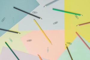 Abstract different multicolored trendy pastel backgrounds with pencils and place for text. Top view. photo