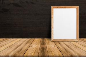 Blank wood frame on tropical wood floor and Dark brown wood wall,template mock up for adding your content photo