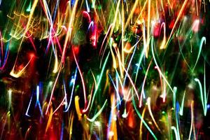 Abstract burred texture background of colorful bokeh motion. Long exposure of small neon lights photo