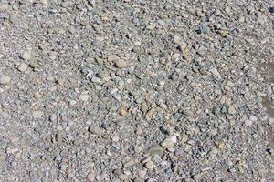 pebble background. Small stones on the seashore photo