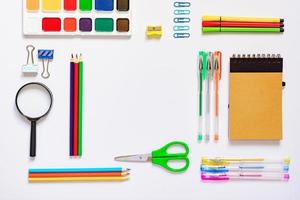 Frame with school supplies on a white background. Flat lay, top view. Back to school concept photo