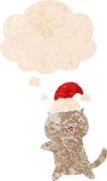 cute cartoon christmas cat and thought bubble in retro textured style vector