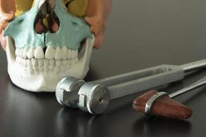 Neurological instruments and skull model on the table photo