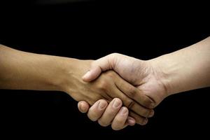 Teamwork of two people on black background photo