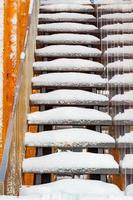 Metal stairs covered with snow after the snowstorm. photo