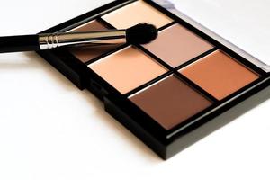 Natural look, Brown tone eye shadows make up palette in black case. photo