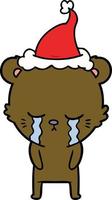 crying line drawing of a bear wearing santa hat vector