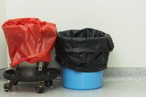 Two empty garbage bins in operating room photo